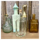 A Collection of Five Vintage Glass Bottles and Bou