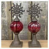 A Pair of Cast Iron and Ruby Red Ribbed Glass Cele