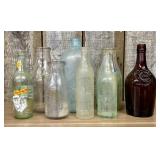 An Assortment of Antique and Vintage Glass Adverti