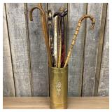An Assortment of Vintage Walking Canes and Adverti