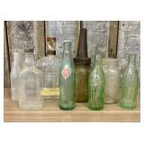 An Assortment of Vintage Glass Soda, Spirit, and S