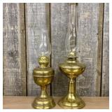 A Pair of Brass Pedestal Kerosene Lamps, One by Do