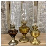 A Trio of Vintage Miniature Oil Lamps with Amber G