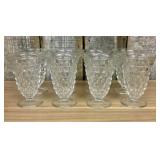 A Set of Eight Clear Pressed Glass Footed Iced Tea