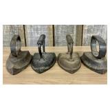 A Set of Four Antique Cast Iron Sad Irons