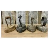 A Group of Four Antique Cast Iron Sad Irons Includ