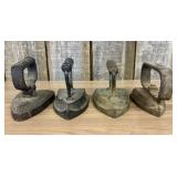 A Collection of Four Antique Cast Iron Sad Irons