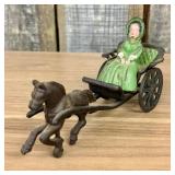 Horse-Drawn Buggy with Seated Female Figure