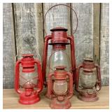 A Collection of Vintage Red Kerosene Lanterns