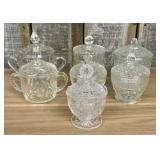 Seven Clear Glass Lidded Table Articles Including