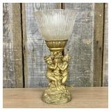 A Classical Style Putti Motif Table Lamp and a Cer