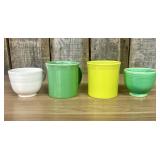 A Collection of Fiestaware Ceramic Mugs and Teacup