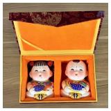 A Pair of Wuxi Huishan Da A Fu Clay Figurines in P