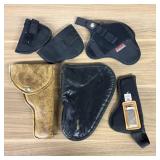 An Assortment of Firearm Holsters and a Browning P