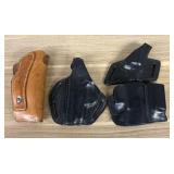 A Group of Leather Firearm Holsters and Magazine P