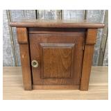 Small Single Door Stained Wood Cabinet with Raised