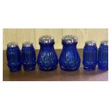 A Collection of Cobalt Blue Pressed Glass Moon and