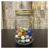 An Assortment of Vintage Glass Marbles in a Gradua