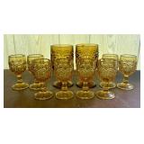 A Ten Piece Collection of Amber Pressed Glass Moon