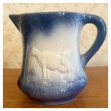 Lincoln Day Signed Blue and White Stoneware Cow Pi