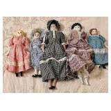 A Collection of Five Vintage Style Porcelain Dolls