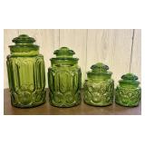 A Set of Four Graduated Pressed Glass Kitchen Cani