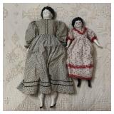 A Pair of China Head Dolls with Cloth Bodies and M