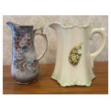 Two Floral Ceramic Pitchers One Earthenware and On