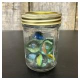 A Collection of Eight Large Glass Shooter Marbles