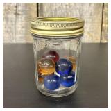 A Collection of Vintage Handmade Glass Marbles in