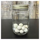 A Collection of Vintage Clay and Glass Marbles in