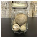 A Group of Five Spherical Stone Game Balls or Proj