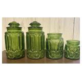 A Set of Four Green Pressed Glass Moon and Star Pa
