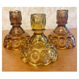 A Trio of Amber Pressed Glass Moon and Star Candle