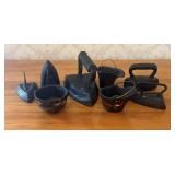 A Collection of Seven Cast Iron Sad Irons and Mini