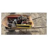 Metal Wheelbarrow With 4 Chainsaws