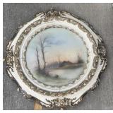 Ornate round picture frame with 1882 water color