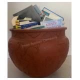 Terracotta flower pot with book contents