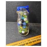Milk bottle full of marbles