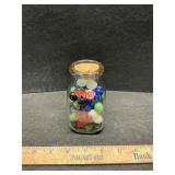 Milk bottle with marbles