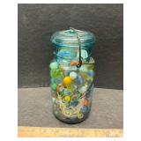 Blue jar with marbles