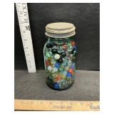 Blue jar with marbles