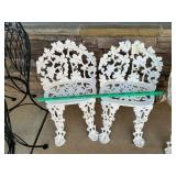 2 cast iron chairs