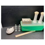 Tupperware, shakers and hen on nest with chip