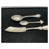 55 grams of sterling silver spoons and knife