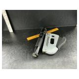 Staple gun and flashlight