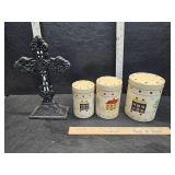 Canisters and cast iron cross