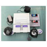 Super Nintendo with 2 games and 2 controllers