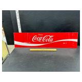 Plastic coke sign