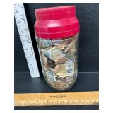 Jar of vintage stamps